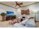 Cozy living room featuring a modern ceiling fan, custom coffee table, and comfortable white sofa at 200 Brightwaters Ne Blvd, St Petersburg, FL 33704