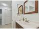 Bathroom with vanity and linen closet at 215 Valencia Blvd # 106, Belleair Bluffs, FL 33770