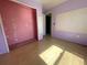 Bedroom with pink walls and laminate wood floors at 2226 Ridgemore Dr, Valrico, FL 33594