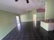 Open living room and kitchen area with dark tile floors at 2226 Ridgemore Dr, Valrico, FL 33594