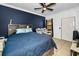 Spacious bedroom with a king-size bed and two armchairs at 2245 Chianti Pl # 718, Palm Harbor, FL 34683