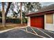 Attached garage with red door, conveniently located near a walkway at 2245 Chianti Pl # 718, Palm Harbor, FL 34683