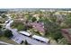 Aerial view of a condo community featuring mature landscaping, covered parking, and a convenient parking lot at 2679 Sabal Springs Cir # 102, Clearwater, FL 33761