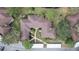 An aerial view of a multi-Gathering residential building with a central courtyard and surrounding greenery at 2679 Sabal Springs Cir # 102, Clearwater, FL 33761