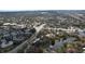 Aerial shot of a condo complex by a lake, situated near a main road and lush greenery at 2679 Sabal Springs Cir # 102, Clearwater, FL 33761