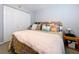 Comfortable bedroom boasts a spacious closet and a soft, inviting bed with decorative pillows at 2679 Sabal Springs Cir # 102, Clearwater, FL 33761