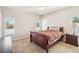 Inviting bedroom with a window and a plush bed and side table at 2813 Punta Palma Ct, Holiday, FL 34691