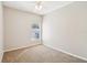 Bright bedroom with neutral carpet, ceiling fan, and window providing natural light at 2813 Punta Palma Ct, Holiday, FL 34691