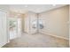 Inviting living room featuring neutral tones, large windows, and a seamless transition to the entryway at 2813 Punta Palma Ct, Holiday, FL 34691