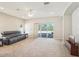 Bright living room with sliding glass doors to the patio, offering seamless indoor-outdoor living at 2813 Punta Palma Ct, Holiday, FL 34691