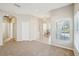 Spacious living room with neutral colors, recessed lighting, and an open floor plan to the office at 2813 Punta Palma Ct, Holiday, FL 34691