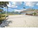 Outdoor sand volleyball court next to community tennis court at 2813 Punta Palma Ct, Holiday, FL 34691