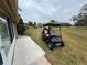 Backyard view with golf cart at 302 Canton Ct # 63, Sun City Center, FL 33573