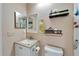 Well-lit bathroom with a vanity and toilet at 302 Canton Ct # 63, Sun City Center, FL 33573