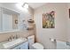 Clean bathroom with toilet, sink, and decorative art at 302 Canton Ct # 63, Sun City Center, FL 33573