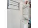 Stackable washer and dryer in a compact laundry room at 302 Canton Ct # 63, Sun City Center, FL 33573