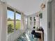 Sunroom with leafy rug, comfy couch, and view of backyard at 302 Canton Ct # 63, Sun City Center, FL 33573