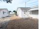 Home's exterior with gravel driveway and AC unit at 3556 Bradford Dr, Holiday, FL 34691