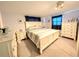 Spacious main bedroom with a large bed and dresser at 3556 Bradford Dr, Holiday, FL 34691