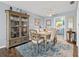 Dining room with wooden table and chairs, and a view of the kitchen at 36639 Jefferson Ave, Dade City, FL 33523