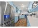 Stainless steel refrigerator in a light blue kitchen at 36639 Jefferson Ave, Dade City, FL 33523