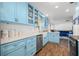 View of light blue kitchen with white countertops at 36639 Jefferson Ave, Dade City, FL 33523