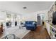 Living room with sectional sofa, built-in shelving, and hardwood floors at 36639 Jefferson Ave, Dade City, FL 33523