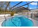 Inviting kidney-shaped pool with screened enclosure at 36639 Jefferson Ave, Dade City, FL 33523