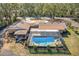 Aerial view showing house, pool, and surrounding area at 3906 Bloomingdale Ave, Valrico, FL 33596