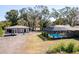 Spacious backyard with pool and detached workshop at 3906 Bloomingdale Ave, Valrico, FL 33596