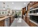 Bright kitchen with stainless steel appliances and granite countertops at 3906 Bloomingdale Ave, Valrico, FL 33596