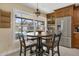 Charming kitchen nook with round table and view of the pool at 3906 Bloomingdale Ave, Valrico, FL 33596