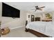 Main bedroom with large TV and comfortable seating area at 3906 Bloomingdale Ave, Valrico, FL 33596