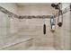 Large walk-in shower with built-in bench and glass enclosure at 3906 Bloomingdale Ave, Valrico, FL 33596