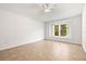 Neutral bedroom with a large window providing natural light at 4251 Whittner Dr, Land O Lakes, FL 34639