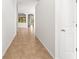 Bright hallway with tile flooring, leading to other rooms in the house at 4251 Whittner Dr, Land O Lakes, FL 34639