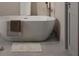 Clean bathroom with a free-standing bathtub and grey tile floor at 4517 26Th S Ave, St Petersburg, FL 33711