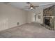 Bedroom with a stone fireplace, a mirrored closet, and neutral carpet at 523 Georgia Ave, Crystal Beach, FL 34681