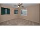 Cozy bedroom with a ceiling fan and carpeted floors at 523 Georgia Ave, Crystal Beach, FL 34681