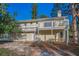 A two-story home with a white porch and wood railings at 523 Georgia Ave, Crystal Beach, FL 34681