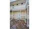 A two-story home with a white porch and wood railings at 523 Georgia Ave, Crystal Beach, FL 34681