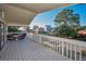 Inviting front porch with table and chairs, a lovely space for relaxing and enjoying the neighborhood at 523 Georgia Ave, Crystal Beach, FL 34681