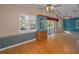 Bright living room with vaulted ceilings, hardwood floors, and a blend of modern and vintage decor at 523 Georgia Ave, Crystal Beach, FL 34681