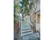 Exterior stairs leading to the home's second story provide access with solid railings for safety at 523 Georgia Ave, Crystal Beach, FL 34681