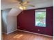 Bedroom with wood floors, window, and ceiling fan at 5607 Tanagergrove Way, Lithia, FL 33547