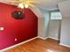 Bedroom featuring wood floors and a wall-mounted TV at 5607 Tanagergrove Way, Lithia, FL 33547