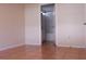 Bedroom features tile flooring and view into bathroom at 5607 Tanagergrove Way, Lithia, FL 33547