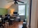 Home office with wood floors and a desk setup at 5607 Tanagergrove Way, Lithia, FL 33547