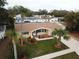 Single story home with large yard and landscaping at 5611 Riddle Rd, Holiday, FL 34690