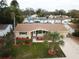 Aerial view showing a charming house with updated landscaping at 5611 Riddle Rd, Holiday, FL 34690